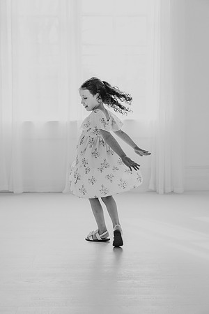 Black and white image of a girl dancing by Monica carlson