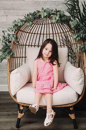 girl sitting in a egg chair in a Alpharetta studio