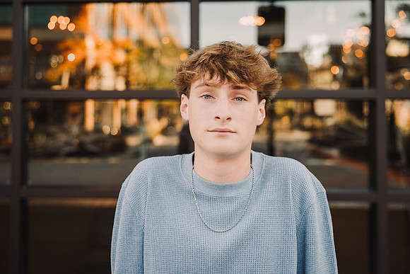 portrait of a serious young man taken by monica carlson