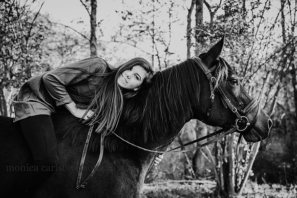 teen girl lays her head on her horses neck