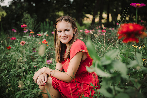 girl in a field of flowers