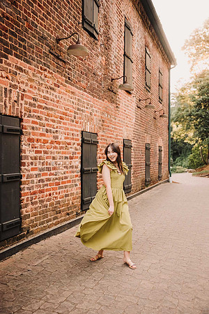 teen girl dancing in front of the ruins at Roswell Mill