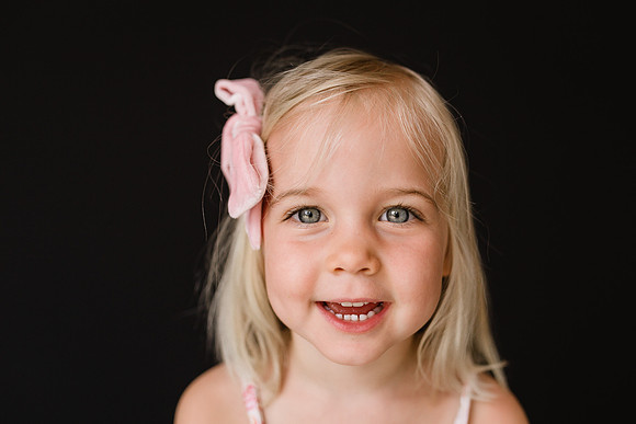 School portrait of a smiling blonde girl