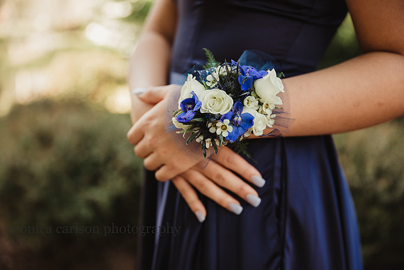 detail image of a young woman wearing a corsage