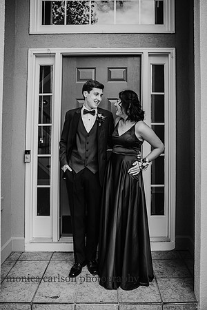 teen with his prom date standing at their front door in alpharetta, Georgia