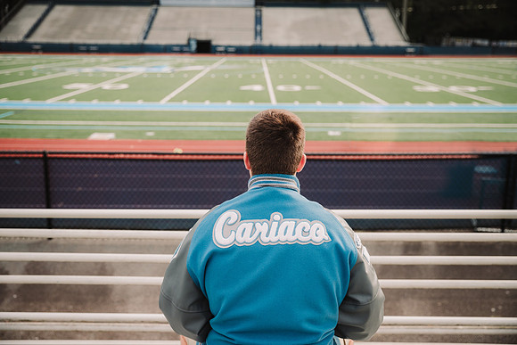 portrait of a teenagers varsity jacket from behind