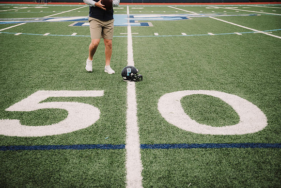 Seniors football helmet on the 50 yard line at pope high school by monica carlson