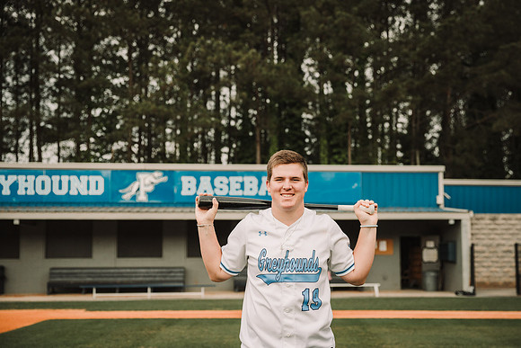 Portrait of a teen boy at the basesball stadium by monica carlson photography