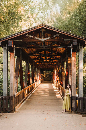 Teen girl on the wooden bridge at Roswell mill