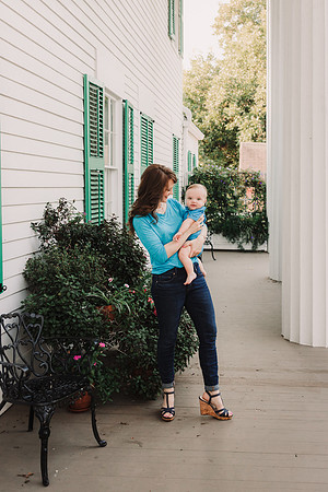 mom holding her son on the patio a plantation home by monica carlson