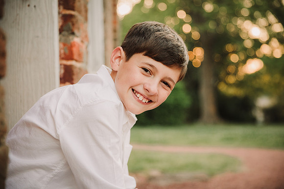 back lit image of a tween boy at Barrington Hall by monica carlson photography