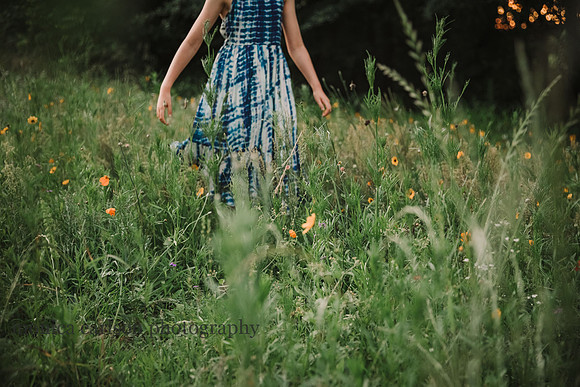 girl walking in a wildflower field at Peospect farms