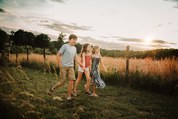 portrait of three kids walking on Prosepct farms by monica carlson photography