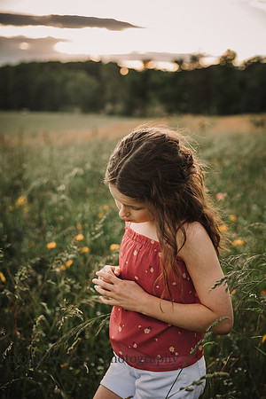 portrait of curly haired tween in a flower field in Lawernceville, GA