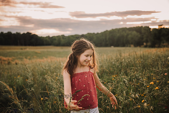 happy tween makes her way through a wildflower field at Prospect farm