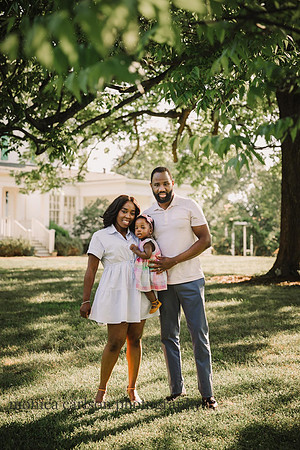 african american family of three in front of Barrington hall in roswell, ga