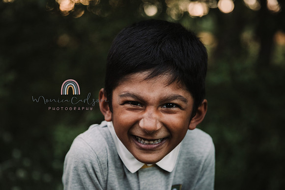 young, indian boy in a collared giggles for monica carlson photography