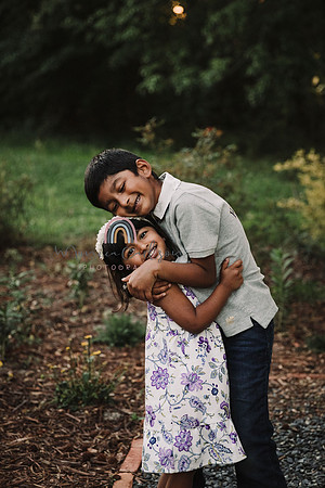 young indian siblings hug each other at Prospect farms