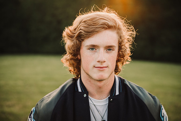 portrait of a red headed senior by monica carlson photography