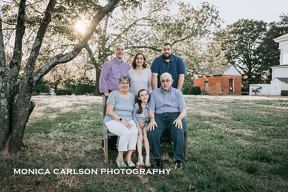 A extended family photo set on the property of Barrington Hall