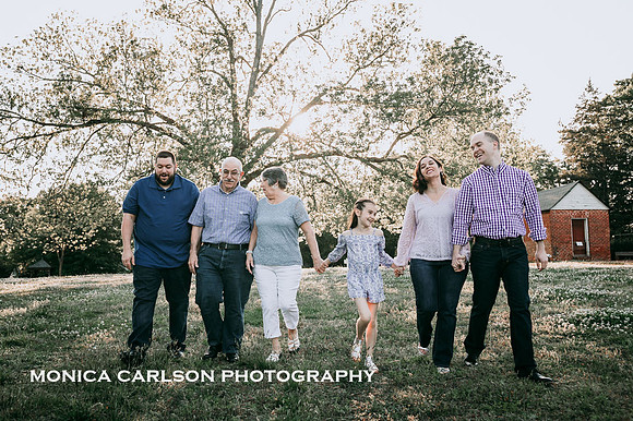 Extended family walking through the grounds of Barrington Hall during a photo session