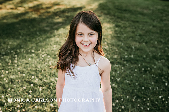 happy little girl in a grassy area
