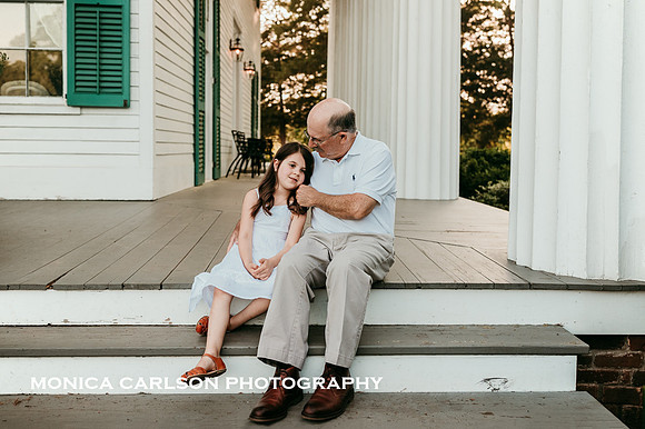 tender moment with a grandfather and his granddaughter on the porch of Barrington Hall by monica carlson photography