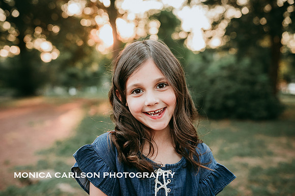 portrait of a brown haired girl taken at sunset