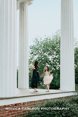 sisters dancing on the patio of Barrington Hall during a photo session