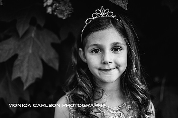 black and white portrait of a young girl wearing a tiara