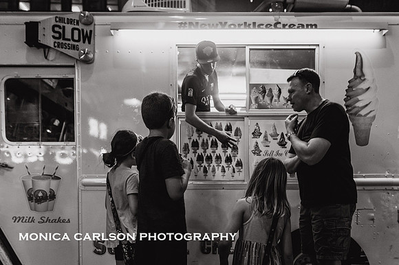 kids getting ice cream on the streets of New york city with their father