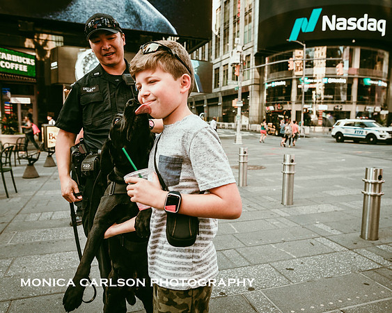 police dog licks a boy on the face in times square