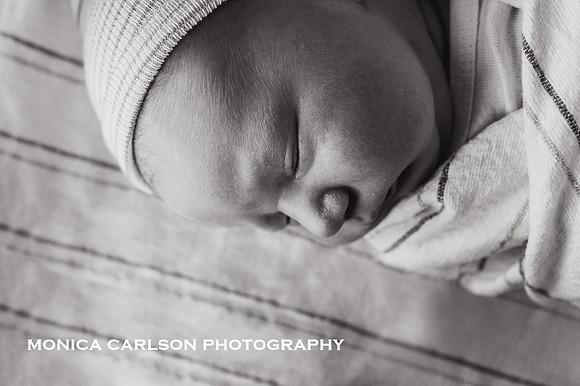 up close, black and white profile photo of a newborn baby at the hospital