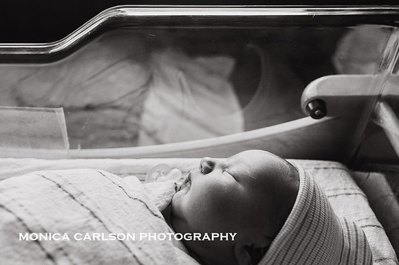 profile portrait in black in white of a newborn in his hospital bassinet outside Atlanta