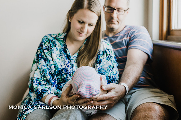 mother and father hold their newborn during its first 48 hours in Northside Hospital