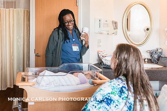 new Mother, in her hospital room, talking to her doctor shortly after delivering her baby