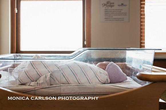 newborn baby in his hospital bassinet by monica carlson photography