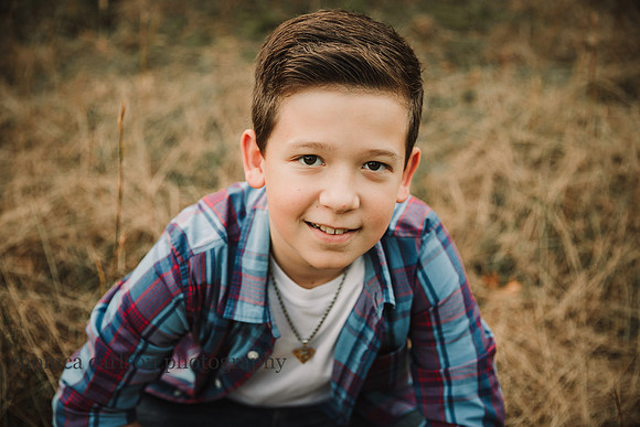 portrait of a tween boy looking at the camera