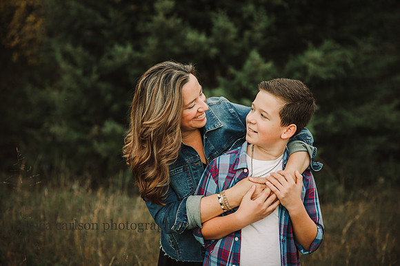 mother and son look at each other fondly