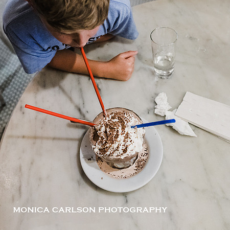 boy drinking a frozen hot chocolate at Serendipity in Manhattan