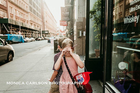 little girl rubs her eyes after a long day of visiting new york city sites