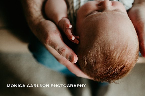 Baby and fathers hands at home