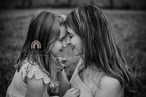 mother and daughter give eskimo kisses