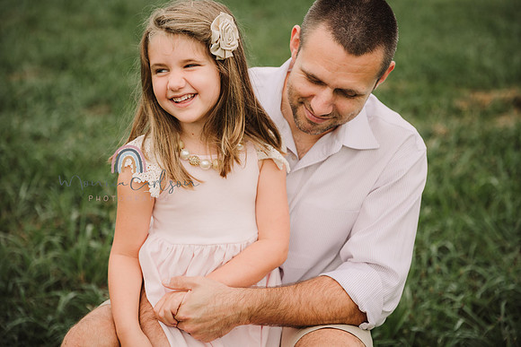 girl and father laugh together
