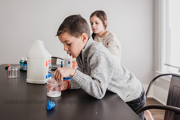 boy making slime during a photo session with monica carlson photography