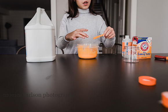tween girl creating slime at home