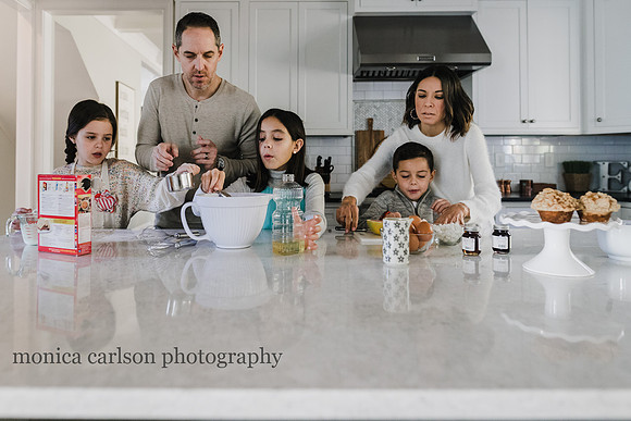 family of five making breakfast during a photo session with monica carlson