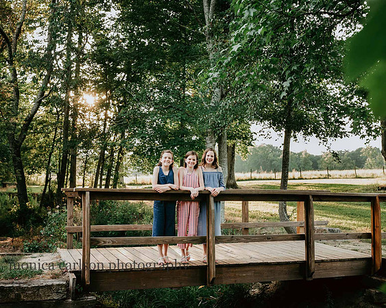 girls standing on a bridge at Prospect farms