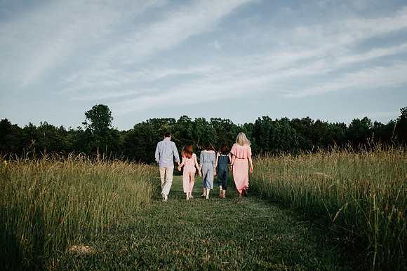 family walking on a open field