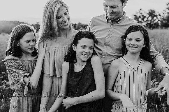 family laughing together at a family photography session